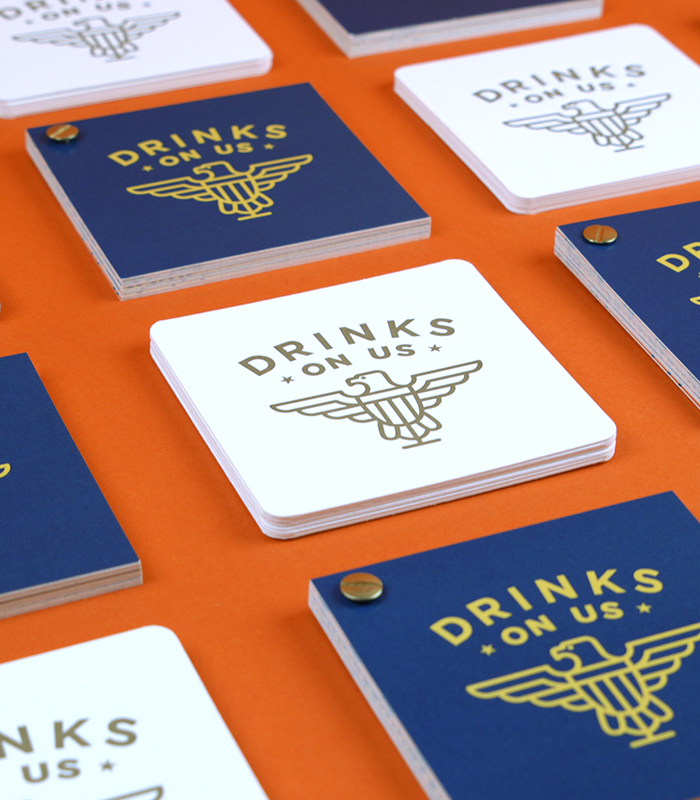 drinks on us brochure and coasters